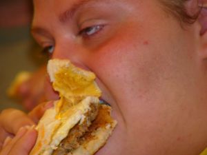 Person eating a hamburger